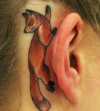 behind ear tattoo fox lying on ear