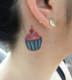 behind ear tattoo pink cupcake