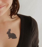 blackwork tattoo rabbit on chest