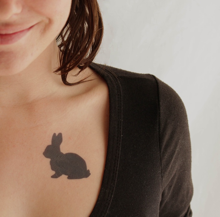 blackwork tattoo rabbit on chest