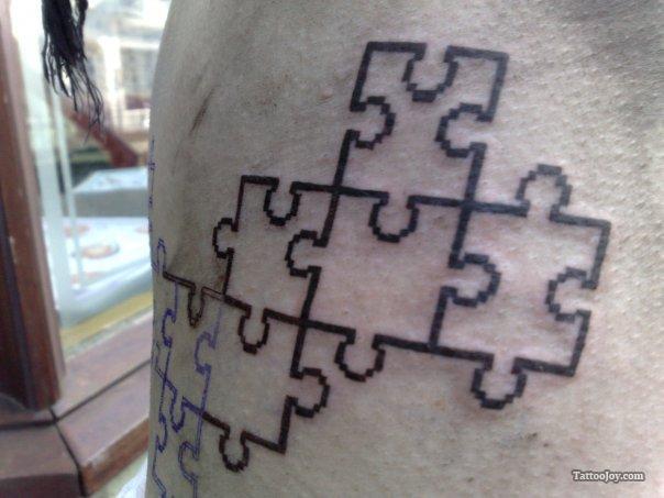 bold puzzle pieces tattoo