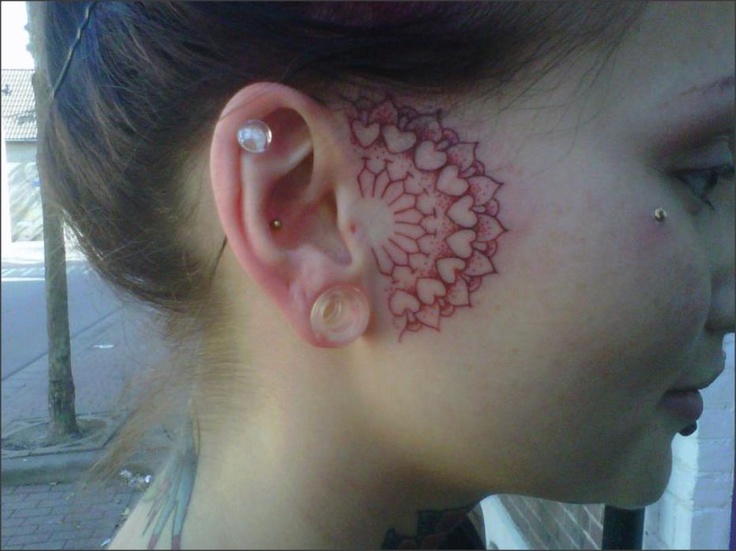in front of ear tattoo red heart paisley