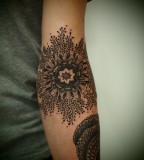 lace tattoo inner arm flower
