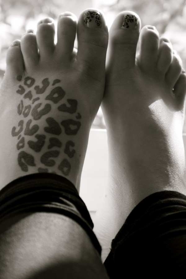 leopard tattoo print on foot