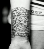 mountain relief tattoo on inside arm