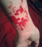 red ink puzzle piece tattoo
