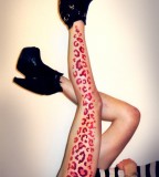 red leopard print tattoo on leg