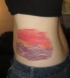 red sky in mountains tattoo