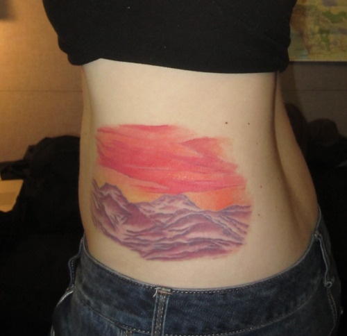 red sky in mountains tattoo