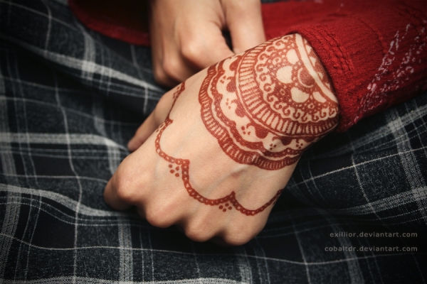 red wrist tattoo by henna
