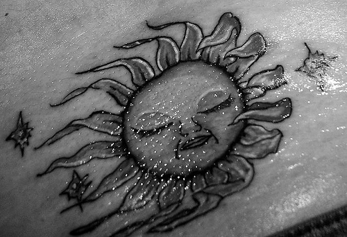 sun tattoo sleeping sun