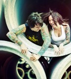 tattooed couple laughing girl