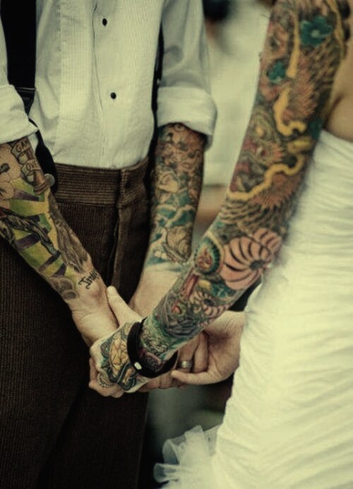 tattooed couple tattoo sleeves on wedding day