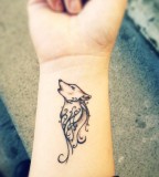 wrist tattoo wolf