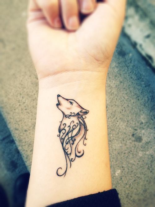 wrist tattoo wolf
