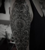 arm sleeve blackwork tattoo by guy le tattooer