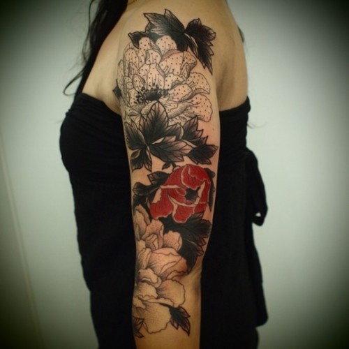 arm sleeve tattoo red flower by guy le tattooer