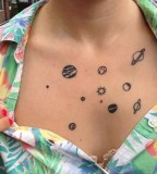 awesome tiny planets tattoo on chest