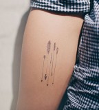 beautiful tiny arrows tattoo