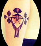 bird on a branch tattoo inspired by charley harper