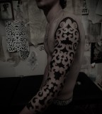 blackwork sleeve tattoo by guy le tattooer