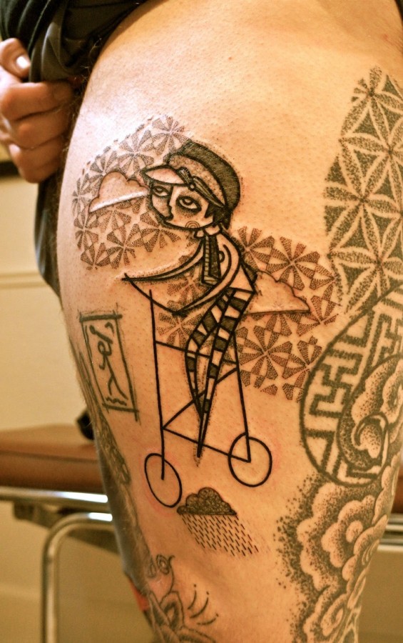 boy on a bike tattoo by noon