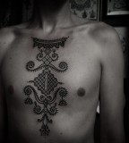 chest blackwork tattoo by guy le tattooer
