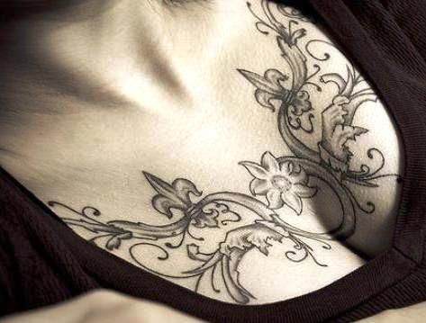 elegant chest tattoo for woman
