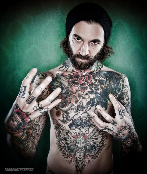 fabrice petre tattoo photography tattooed guy in green background