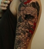 flower tattoo arm sleeve by guy le tattooer