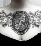 framed female skeleton chest tattoo