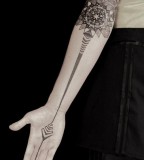 geometric inside arm tattoo