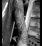 geometric tattoo arm sleeve flowers
