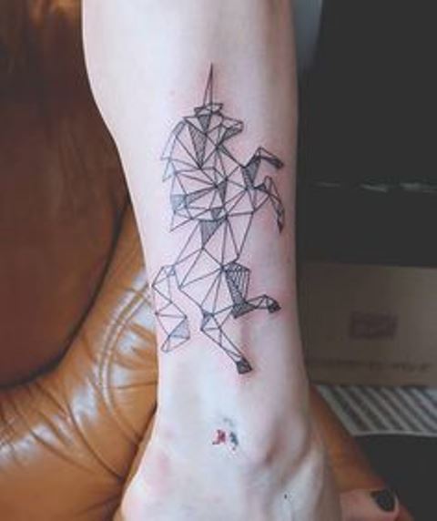 geometric unicorn tattoo by diana katsko
