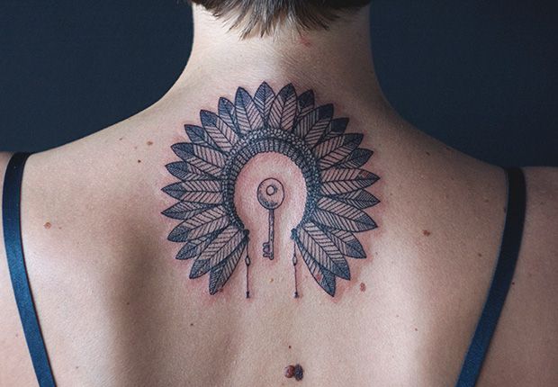 key and indian feather head piece tattoo by diana katsko