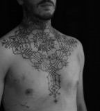 neck and chest tattoo by jean philippe burton