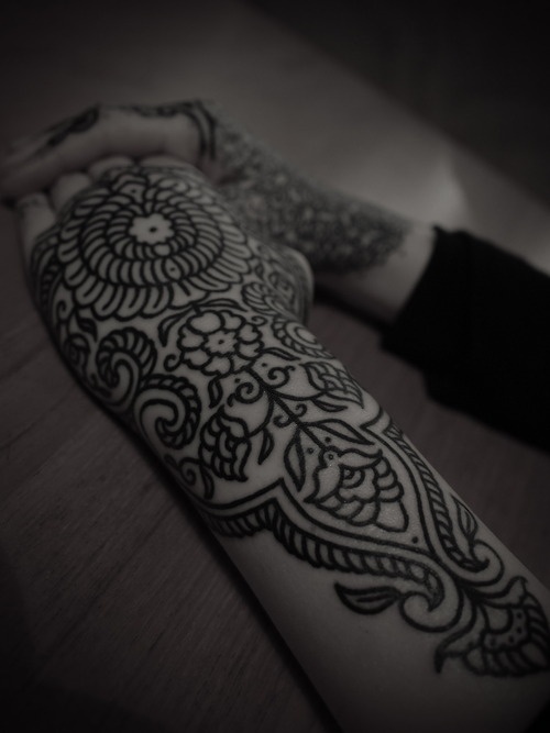 ornamental pattern hand and arm sleeve tattoo by guy le tattooer