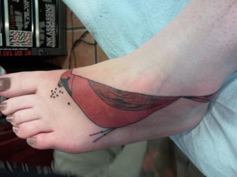 red bird tattoo on feet inspired by charley harper