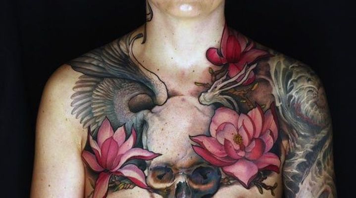 skull and pink flowers female chest tattoo