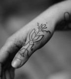 thumb tattoo by jean philippe burton
