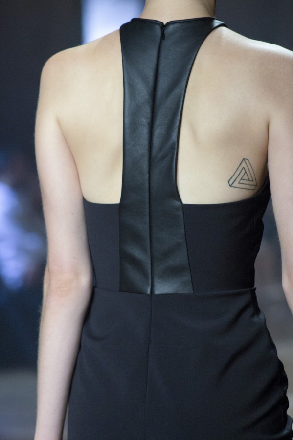 tiny triangle tattoo on back