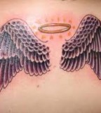 Adorable wings tattoo