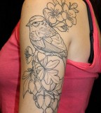 Bird and flowers tattoo