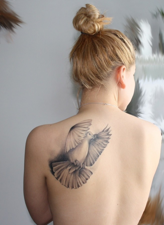 Black and white bird tattoo
