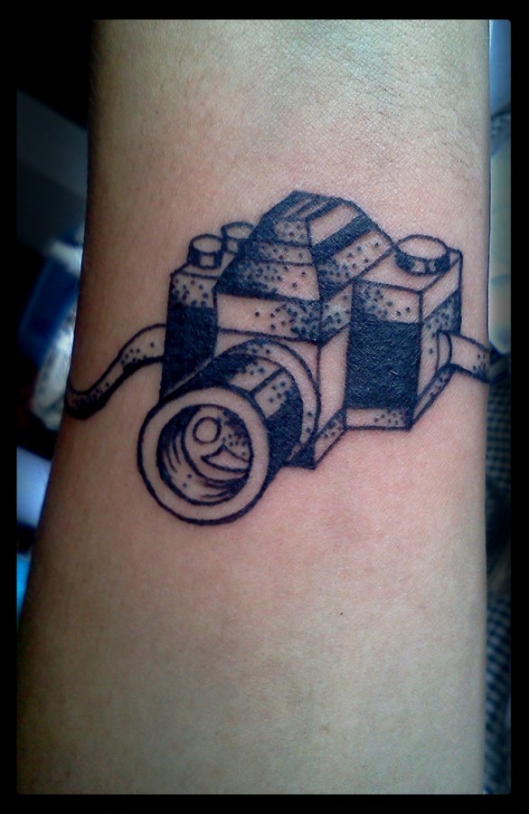 Black and white camera tattoo