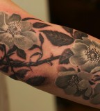 Black and white flowers tattoo