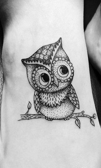Black and white owl tattoo