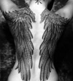 Black and white wings tattoo