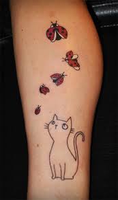 Cats and ladybird tattoo