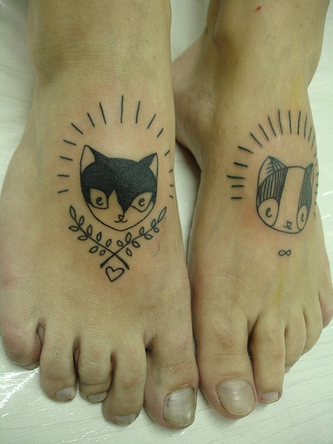 Cats tattoos on foots